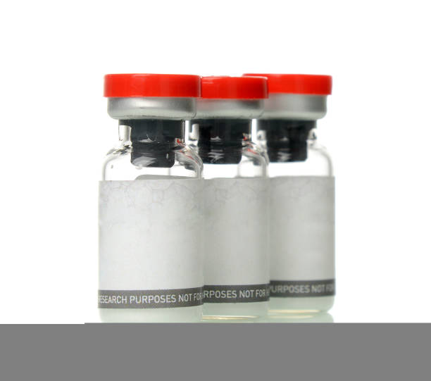 Glass vials for liquid samples. Laboratory equipment for dispensing fluid samples with text copy space isolated on white background
